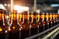 Row of Beer Bottles on Conveyor Belt, Production and Packaging Process in Brewery, Glass brown bottles of beer on conveyor belt Royalty Free Stock Photo