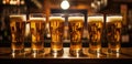 a row of beer glasses lined up in a bar