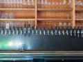 Row of beer taps in back of bar with sunny light Royalty Free Stock Photo