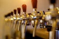 A row of beer taps in a bar Royalty Free Stock Photo