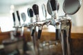 Row of beer taps at cafe Royalty Free Stock Photo