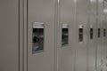 Row of Beige Middle or High School Lockers and Locks Royalty Free Stock Photo