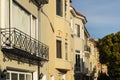 A row of beige upscale houses against blue sky