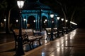 a row of benches lined up in a park at night