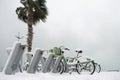 Row of bicycles covered with snow at the street Royalty Free Stock Photo