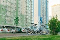 Row of bicycles for rent against the backdrop of the cityscape. Bicycle sharing concept. Background Royalty Free Stock Photo