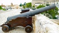 Row of big black canons on a castle wall Royalty Free Stock Photo