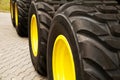 Row of big yellow truck wheels background Royalty Free Stock Photo