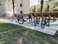 Row of bike racks full of bikes