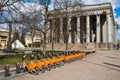 Row of bikes parked for hire, city bikes rent parking, public bicycle sharing system