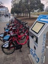 Row of bikes for rent, bike share kiosk