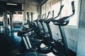 Row of Biking Exercise Equipment in Fitness Club, Interior of Gym Training Center and Working Out Cycling Machine, Sport and Royalty Free Stock Photo