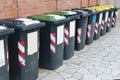 Row of bins for the separate collection of glass, paper and aluminum