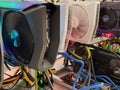 Row of bitcoin miners set up on the wired shelfs. Device for mining crypto currency. Mining cryptocurrency. Bitcoin farm
