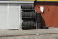 A row of black new car tires on the street Royalty Free Stock Photo