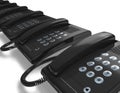 Row of black office phones