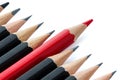 Row of black pencils with one red pencil Royalty Free Stock Photo