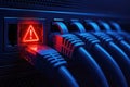 Server rack with multiple ethernet cables and a red warning light network connection Royalty Free Stock Photo