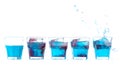 Row of blue fresh alcohol cocktails in a glass mixed with red al