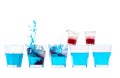 Row of blue fresh alcohol cocktails in a glass mixed with red al