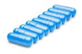 Row of blue medical pills on isolated white background Royalty Free Stock Photo