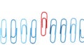 Row of blue paperclips with one unique red one standing out from the others Royalty Free Stock Photo