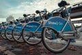 Row of blue Shaw Go Mobi bikes lined up near skytrain in Downtown Vancouver Canada Royalty Free Stock Photo