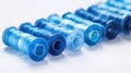 A row of blue and white thread spools Royalty Free Stock Photo