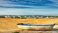 Row boat ashore on the Spanish beach in Sancti Petri Royalty Free Stock Photo