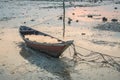 Row boat on the beach filled of water. Royalty Free Stock Photo