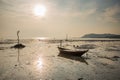 Row boat on the beach filled of water. Royalty Free Stock Photo