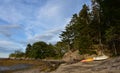 Row Boat and a Kayak on a Deserted Beach Royalty Free Stock Photo