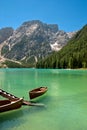 Row boat on a lake with mountains in he background Royalty Free Stock Photo