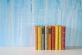 Row of books on grungy background Royalty Free Stock Photo