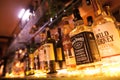 Row of bottles of alcohol in a bar or restaurant Royalty Free Stock Photo