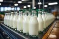 A row of bottles of milk on a conveyor belt