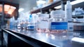 A row of bottles with pills, medicines and cosmetics sitting on top of a counter in pharmacy shop Royalty Free Stock Photo