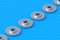 Row of brake discs on blue boards