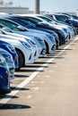 Brand new cars lined up in a parking lot Royalty Free Stock Photo