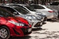 Row of brand new cars toyota yaris lined up outdoors in a parking lot Royalty Free Stock Photo