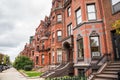 Row of brick residential buildings along a street Royalty Free Stock Photo