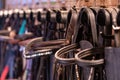 Row of bridles in a tack room on a horse riding farm