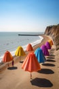 a row of bright beach umbrellas on the coast