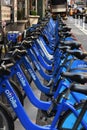 Row of bright blue bikes in Citi bike Rentals