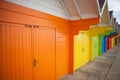 Row of bright colored beach huts. Royalty Free Stock Photo
