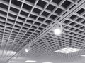 Bright halogen spotlights on exhibition ceiling grid