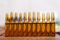 Row of brown vials filled