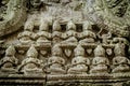 Row of Buddha sculptures outside temple