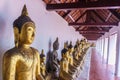 Row buddha statue at Wat Phra Borommathat Chaiya Royalty Free Stock Photo