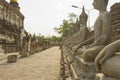 Row of Buddha statues in Wat Yai Chaimongkol in Ayutthaya Royalty Free Stock Photo